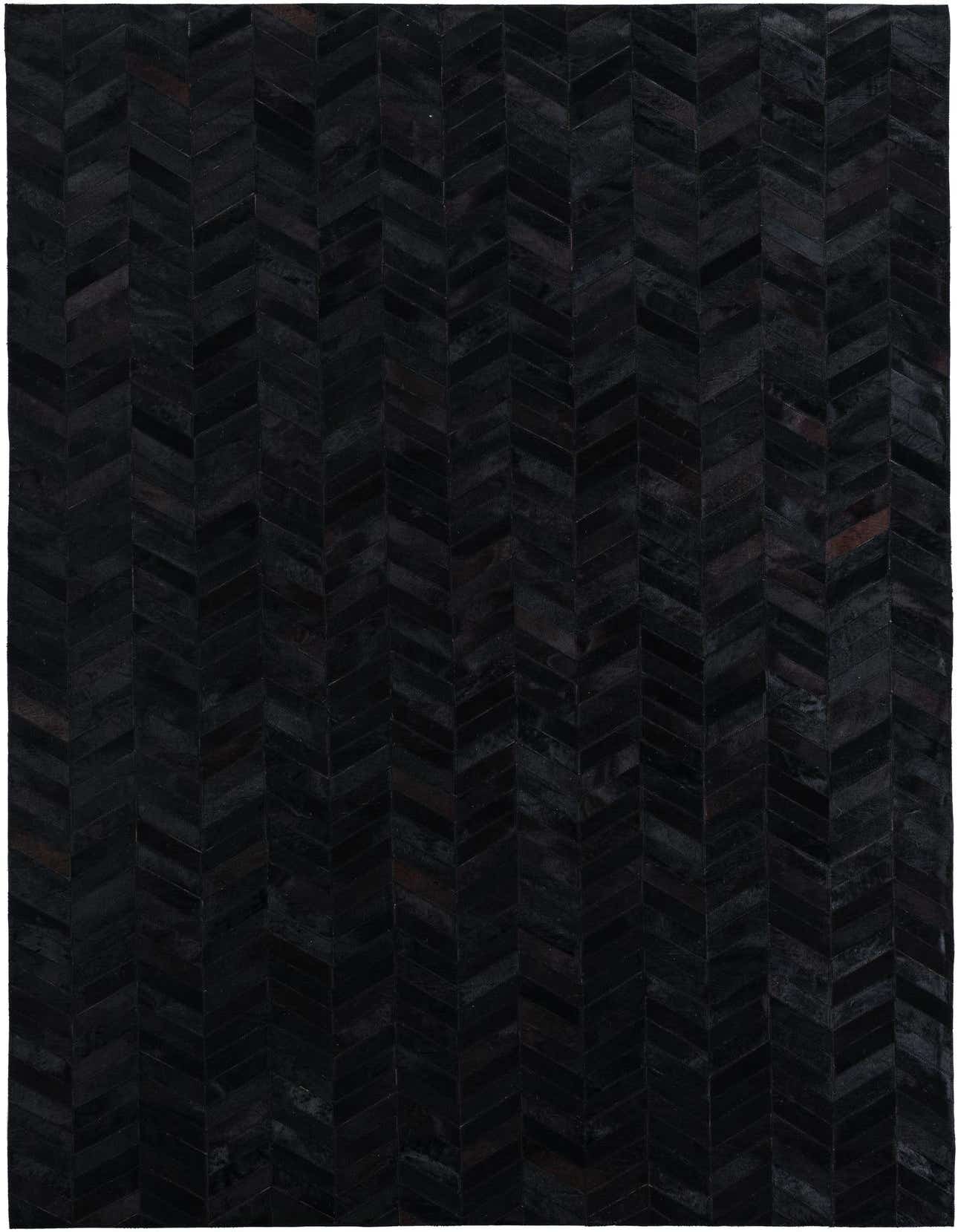 A 5x8 rectangular black cowhide leather rug featuring a modern chevron pattern, perfect for a living room.