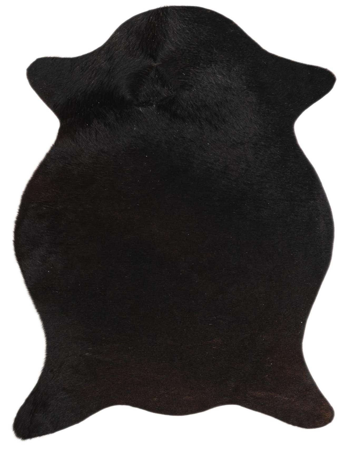 A 2x3 rectangular black cowhide rug with a natural, irregular shape, featuring a flat, textured pile.