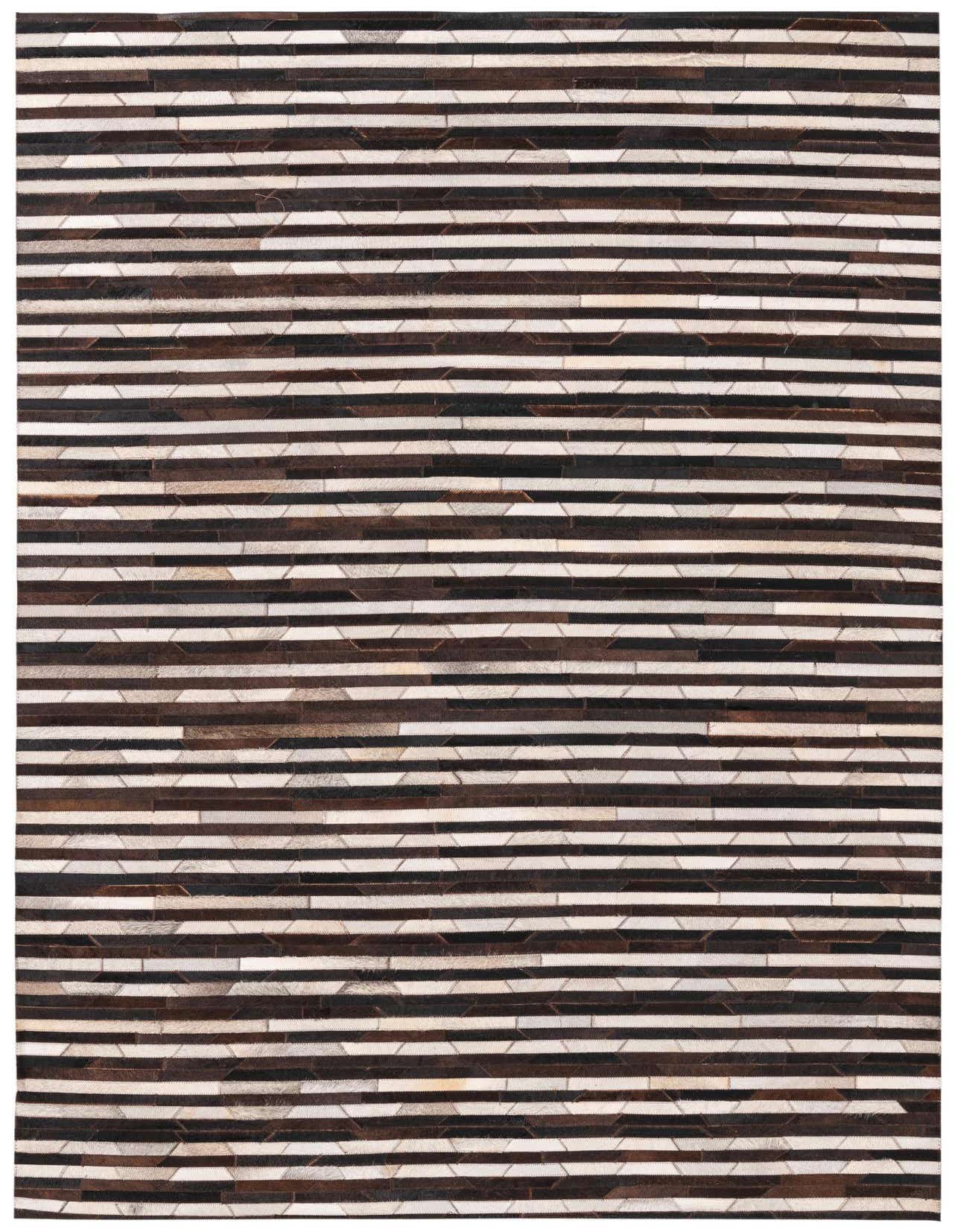 A rectangular 5x8 modern black and white striped cowhide rug, handmade with a flat pile, suitable for a living room.