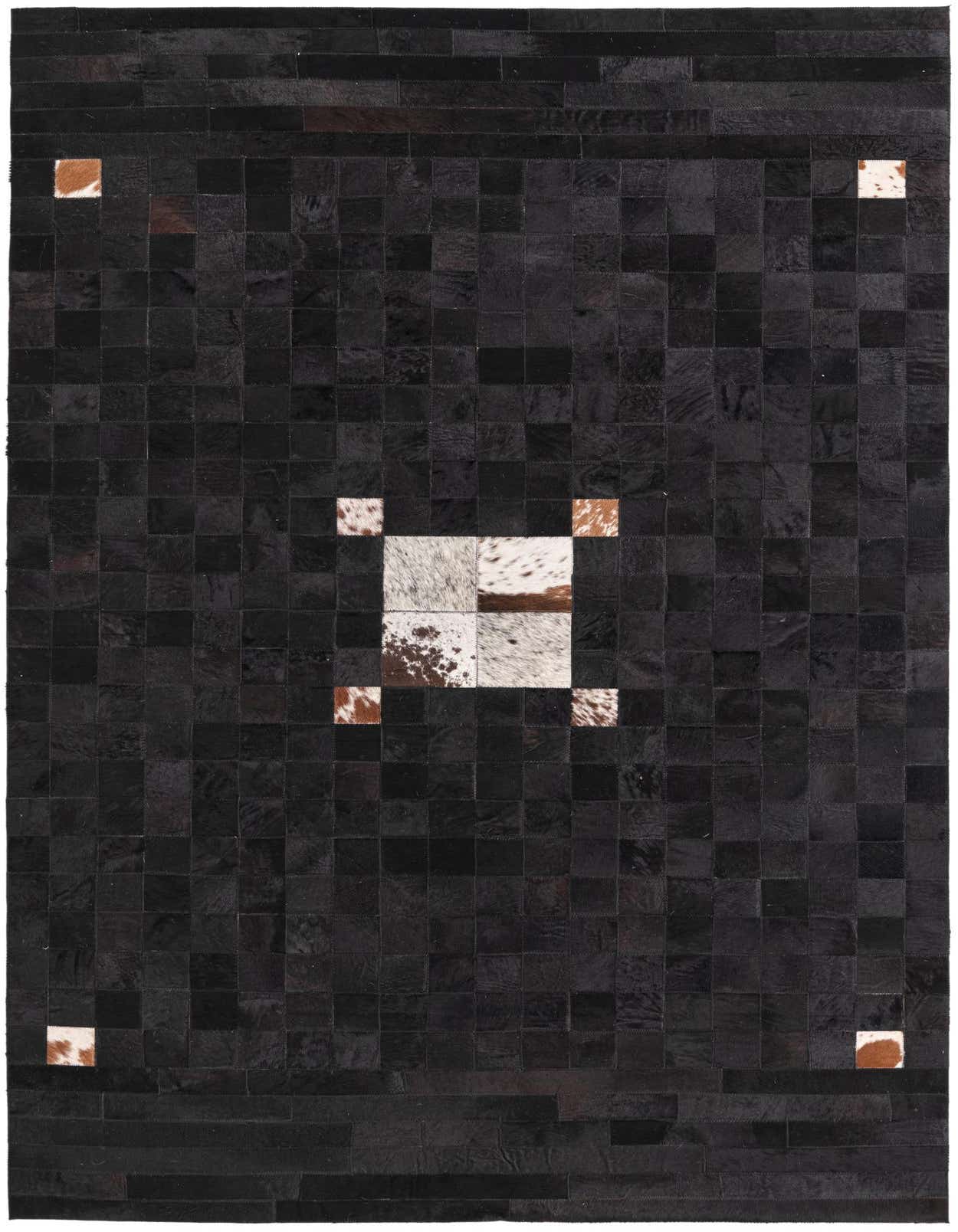 A 5x8 rectangular black cowhide rug with a modern patchwork design, featuring a central square of white and brown speckled patches, and smaller speckled patches in each corner.