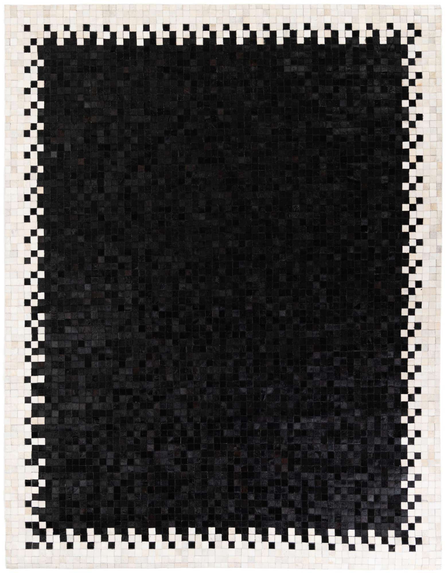 A rectangular 8x10 black patchwork cowhide rug with a white and black geometric border.