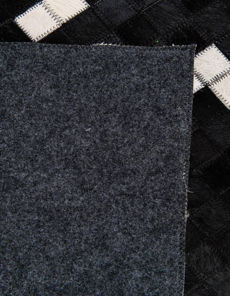 Detail image of  7' 11 x 9' 10 Cowhide Stocks Rug