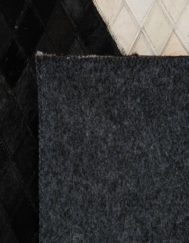 Detail image of  7' 11 x 9' 10 Cowhide Stocks Rug