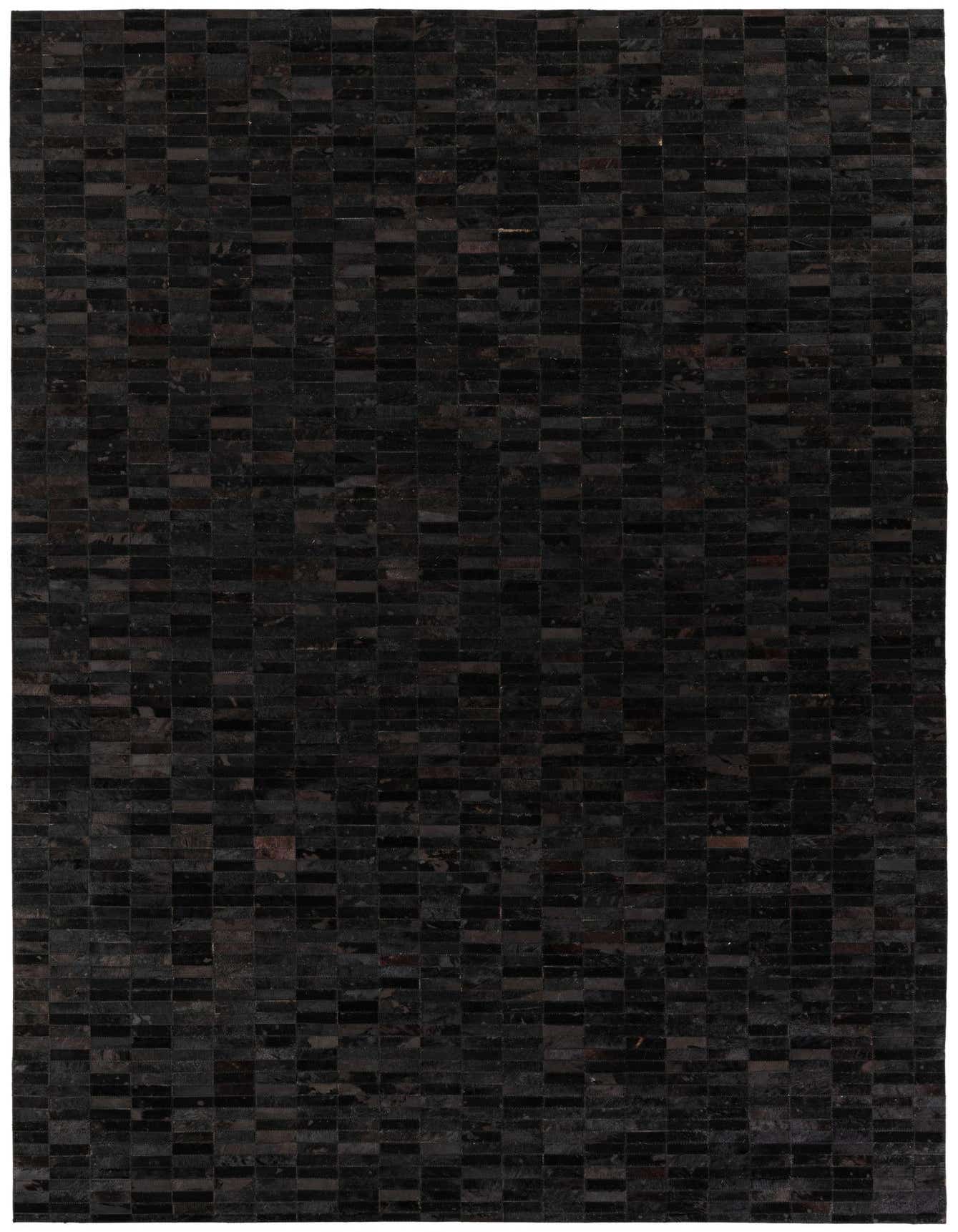 A 6x9 rectangular modern black cowhide rug featuring a patchwork of varying dark tones, ideal for a living room.