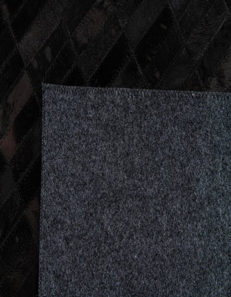 Detail image of  5' 11 x 9' Cowhide Stocks Rug