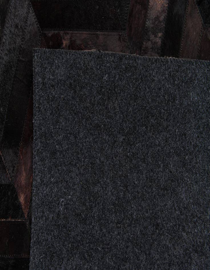 Detail image of  6' x 8' 11 Cowhide Stocks Rug