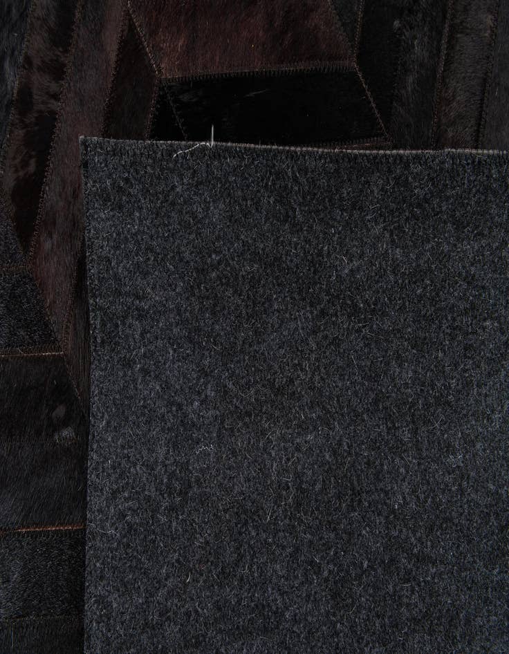 Detail image of  6' x 8' 11 Cowhide Stocks Rug