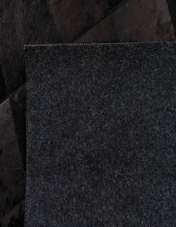 Detail image of  6' x 8' 11 Cowhide Stocks Rug