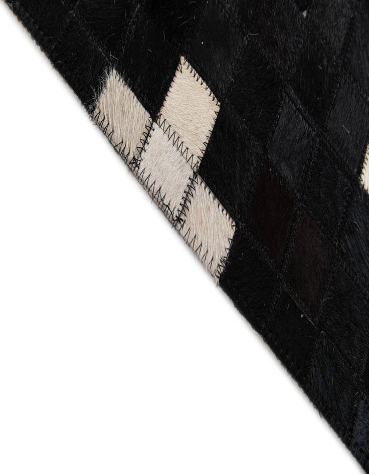 Detail image of  5' 2 x 7' 11 Cowhide Stocks Rug