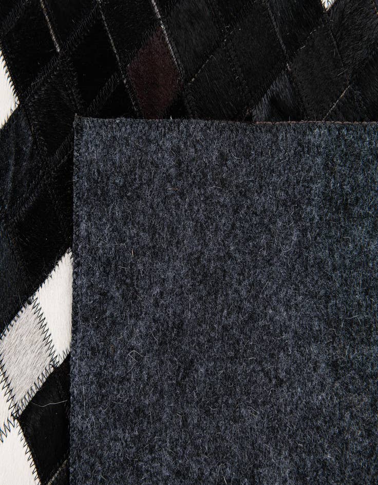 Detail image of  5' 2 x 7' 11 Cowhide Stocks Rug