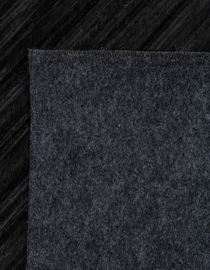 Detail image of  5' x 8' Cowhide Stocks Rug