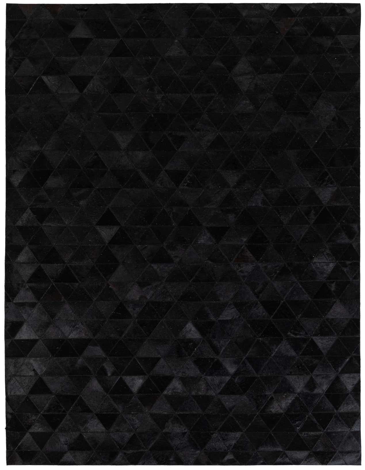A 5x8 rectangular black modern cowhide rug with a geometric triangular pattern, suitable for a living room.