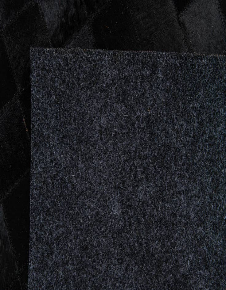 Detail image of  4' 11 x 7' 11 Cowhide Stocks Rug