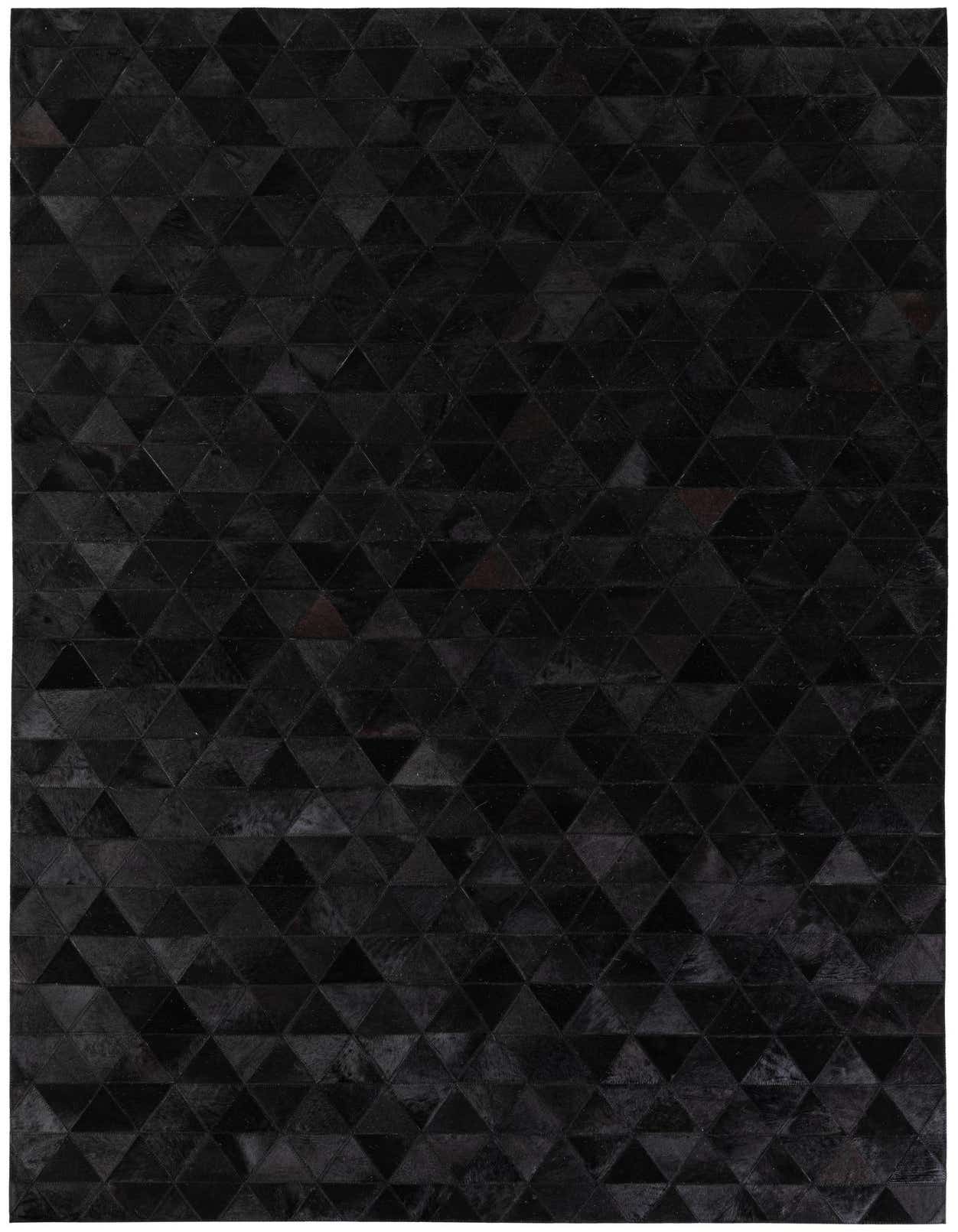 A 5x8 rectangular black modern cowhide rug featuring a geometric triangular pattern, suitable for a living room.