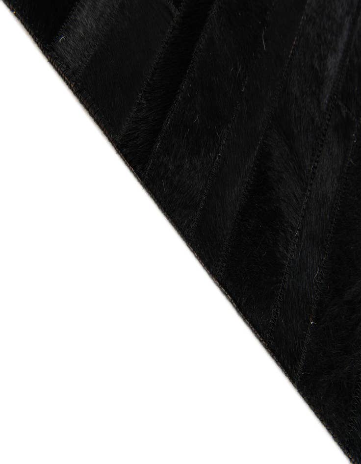 Detail image of  5' x 7' 11 Cowhide Stocks Rug