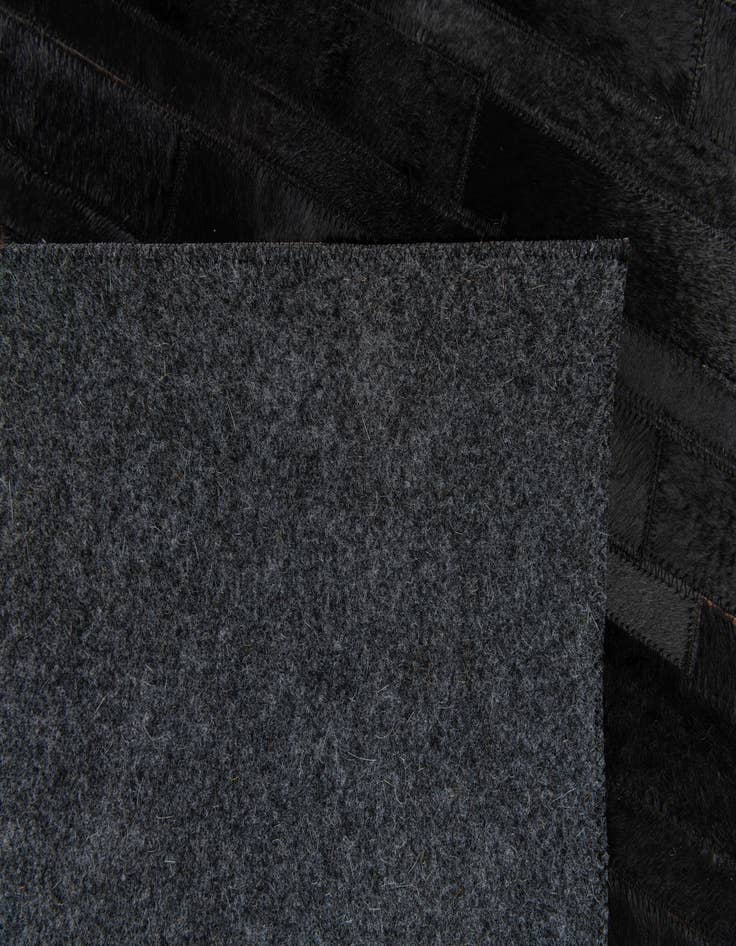 Detail image of  5' x 7' 11 Cowhide Stocks Rug