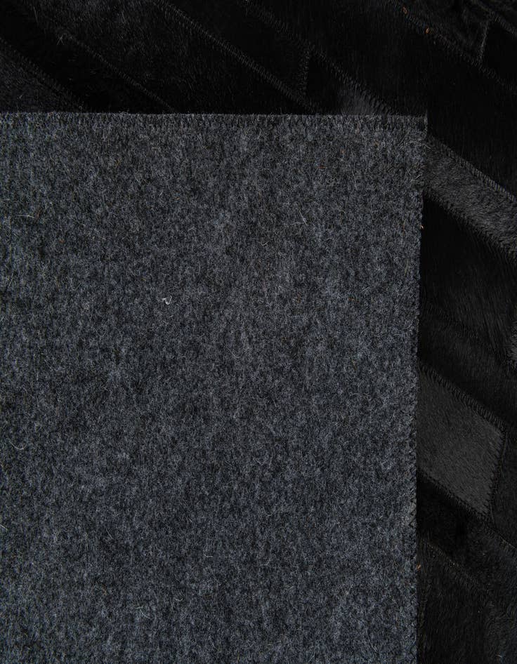 Detail image of  4' 11 x 7' 11 Cowhide Stocks Rug