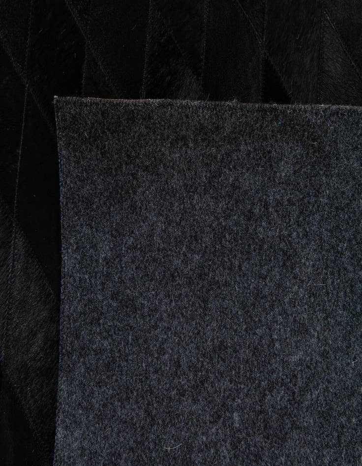 Detail image of  5' 1 x 8' Cowhide Stocks Rug