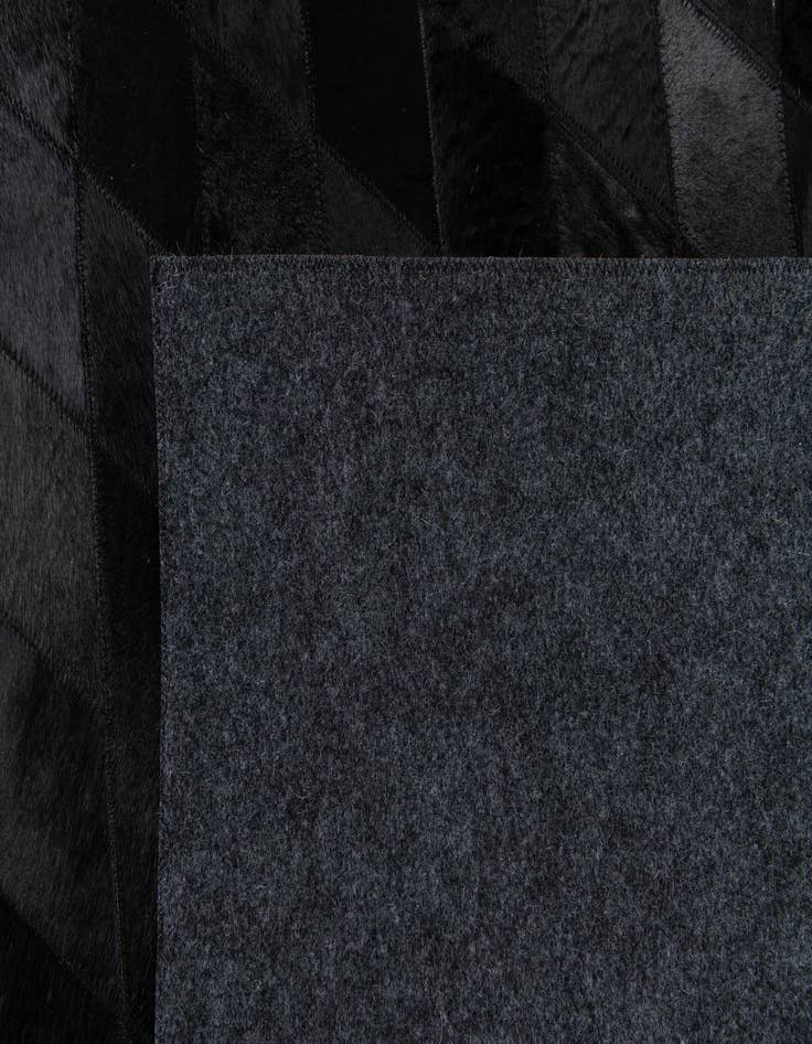 Detail image of  5' 2 x 8' Cowhide Stocks Rug