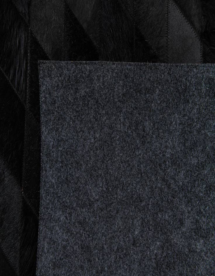 Detail image of  5' 2 x 8' Cowhide Stocks Rug