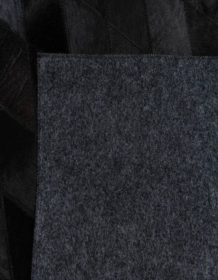 Detail image of  5' 2 x 8' Cowhide Stocks Rug