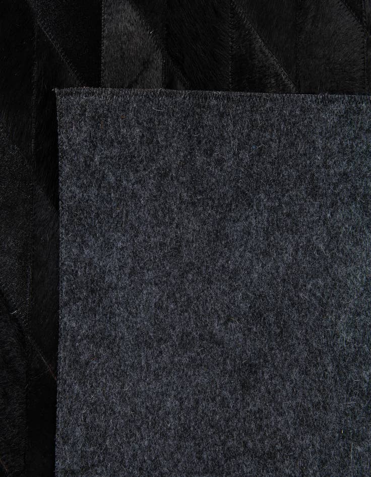 Detail image of  5' 1 x 8' Cowhide Stocks Rug