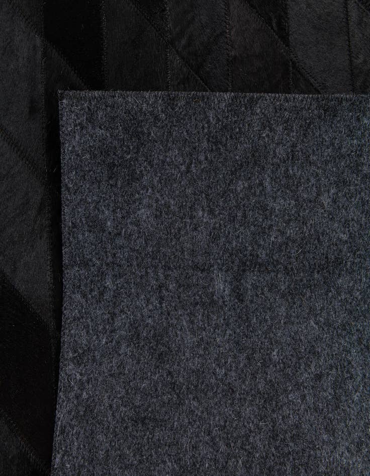 Detail image of  5' 2 x 7' 11 Cowhide Stocks Rug