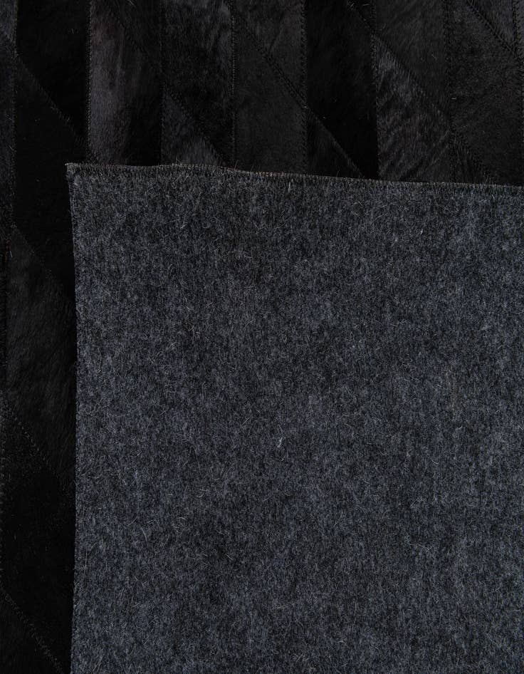 Detail image of  5' 2 x 7' 11 Cowhide Stocks Rug