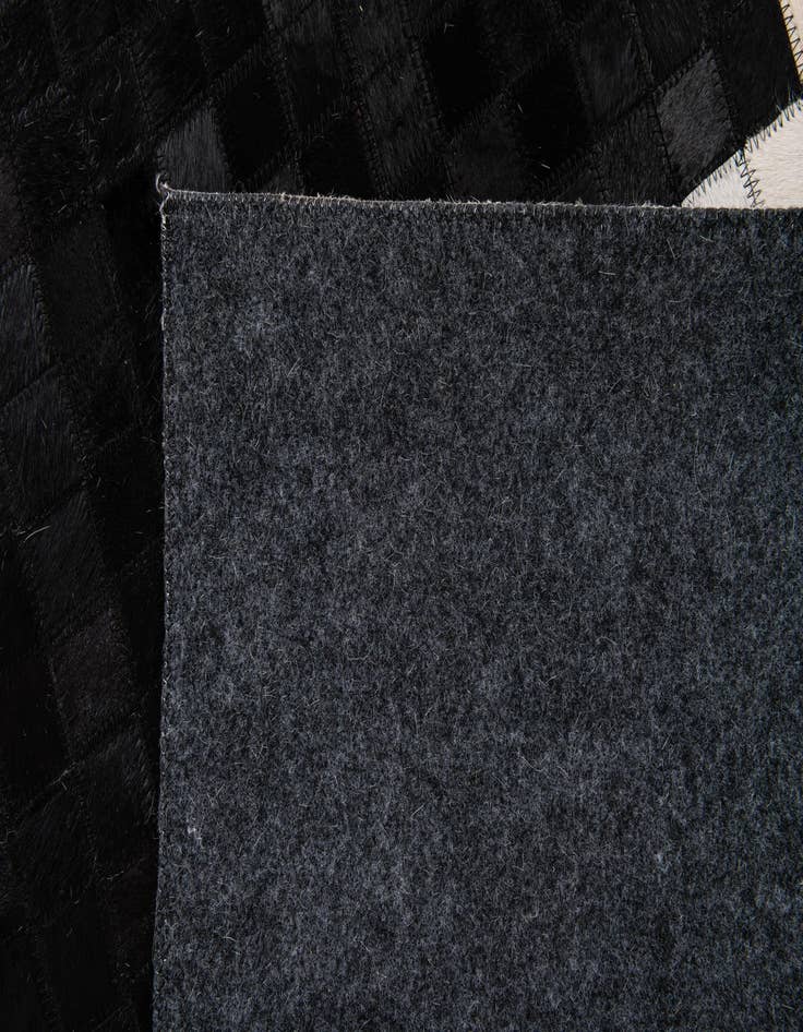 Detail image of  5' 2 x 7' 11 Cowhide Stocks Rug