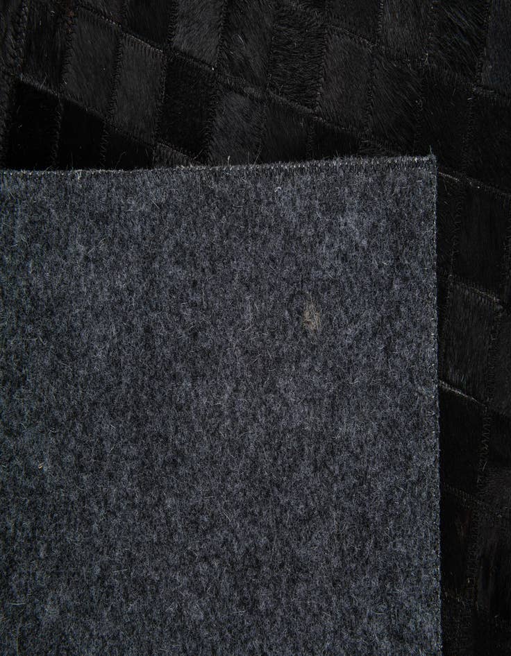 Detail image of  4' 11 x 7' 11 Cowhide Stocks Rug