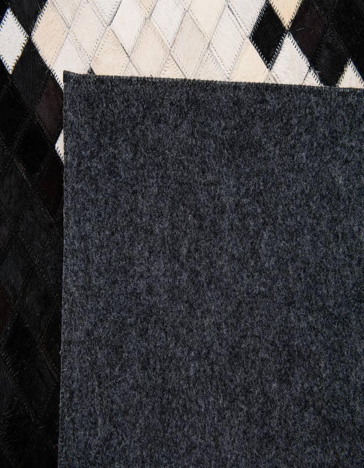 Detail image of  5' 2 x 8' 1 Cowhide Stocks Rug