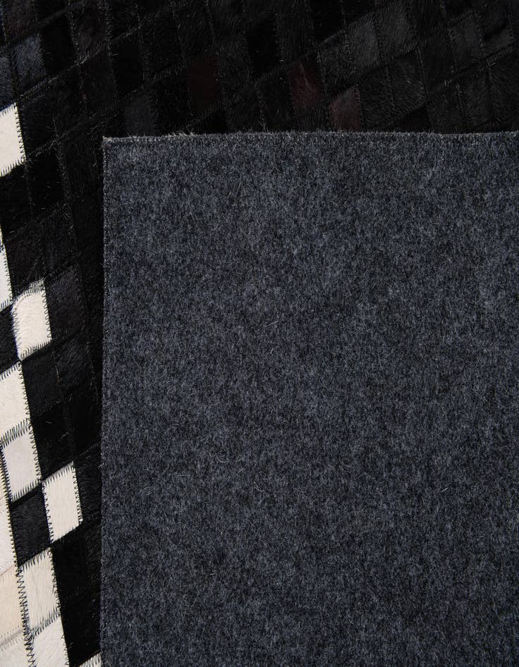 Detail image of  5' 1 x 7' 11 Cowhide Stocks Rug