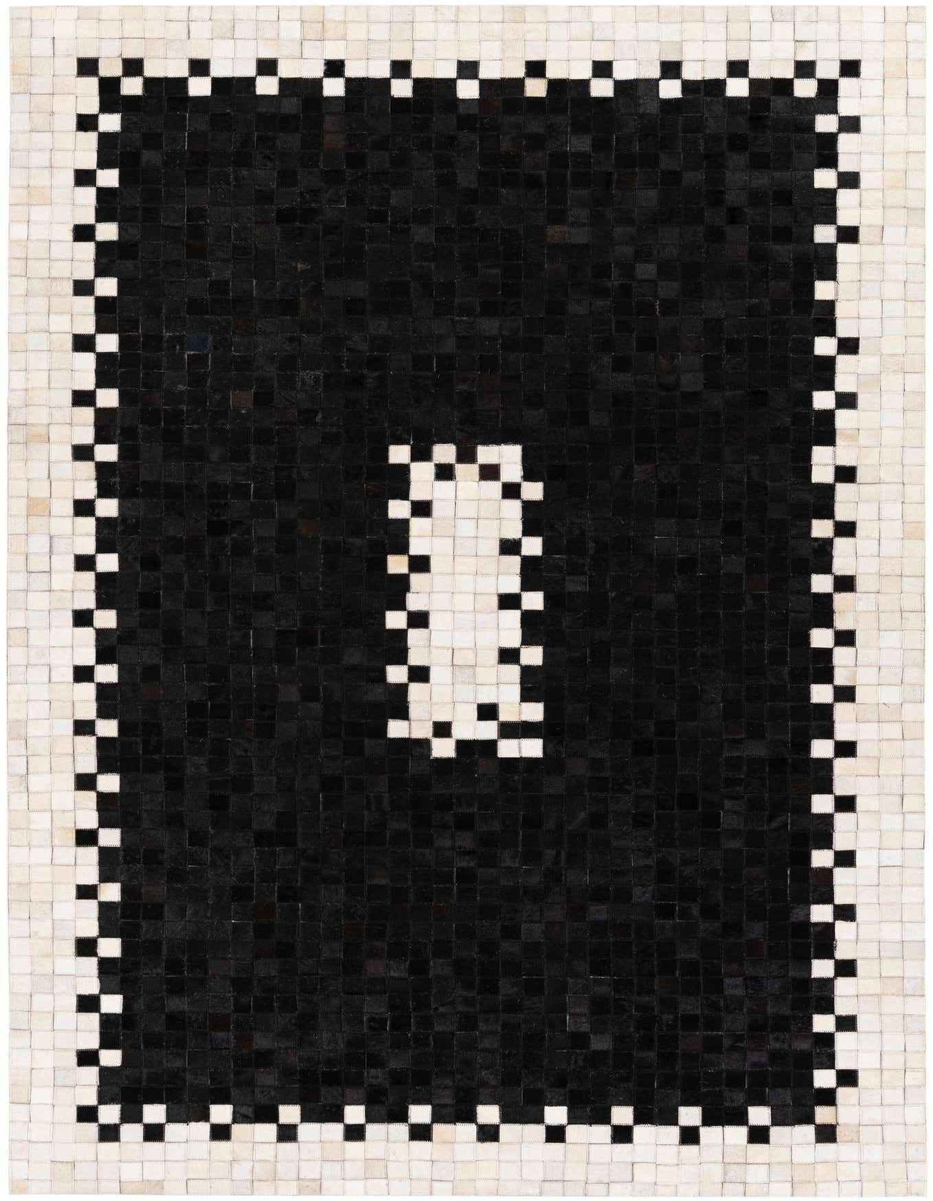A 5x8 rectangular black modern cowhide rug with a white border and a central white rectangular design, made from small square patches.