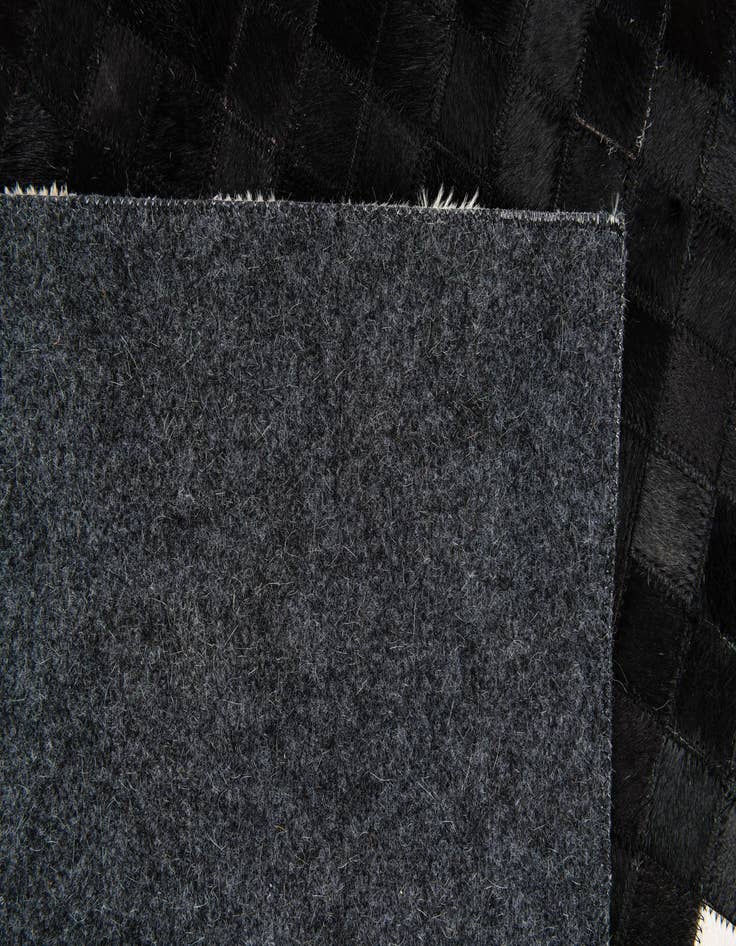 Detail image of  5' 2 x 7' 11 Cowhide Stocks Rug