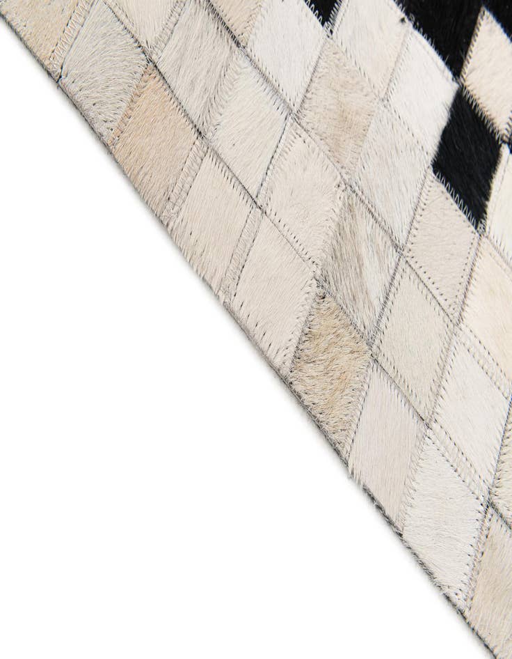 Detail image of  5' x 7' 9 Cowhide Stocks Rug