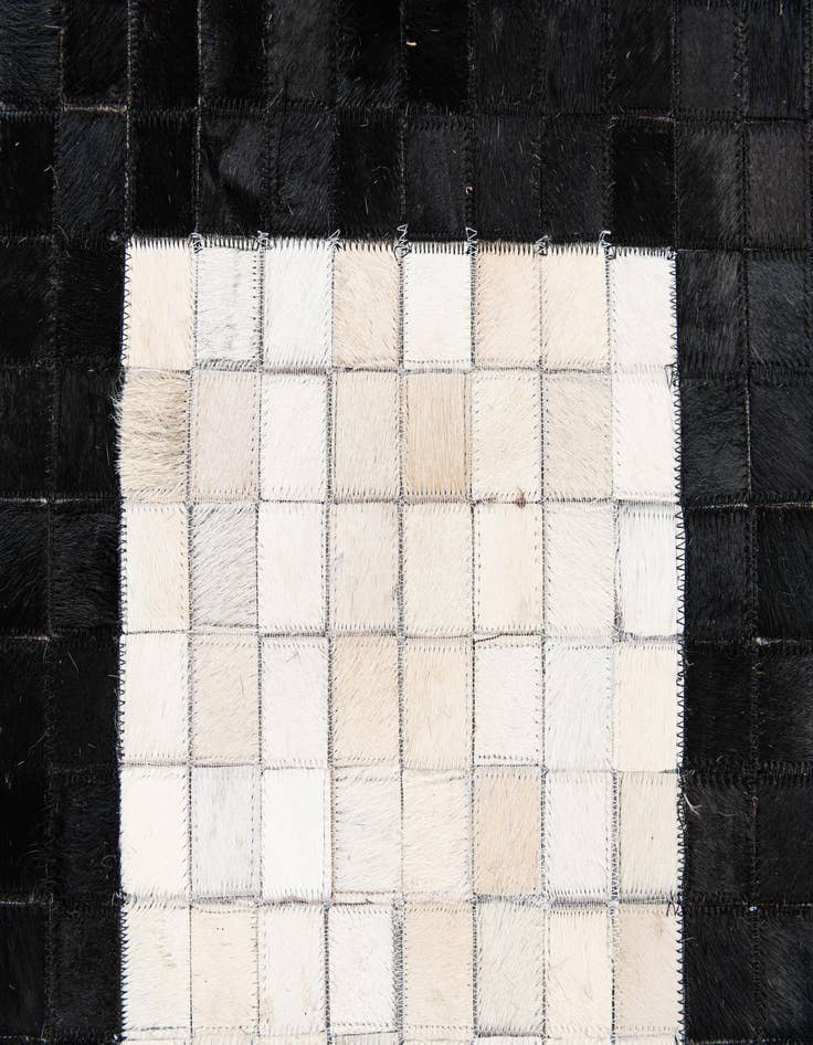 Detail image of  4' 11 x 7' 10 Cowhide Stocks Rug