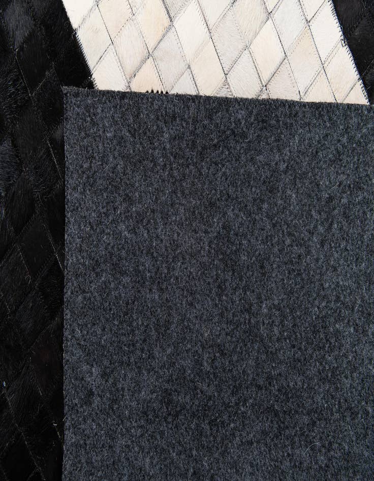 Detail image of  4' 11 x 7' 10 Cowhide Stocks Rug