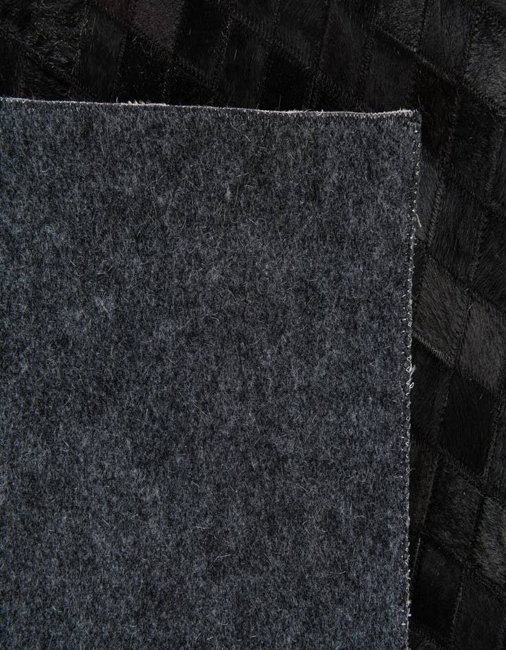 Detail image of  5' 2 x 8' Cowhide Stocks Rug