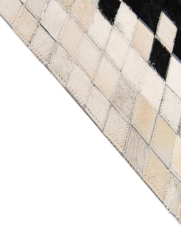 Detail image of  4' 11 x 7' 10 Cowhide Stocks Rug