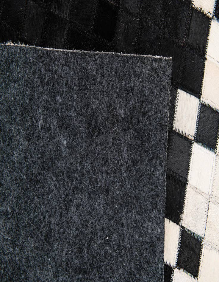Detail image of  4' 11 x 7' 10 Cowhide Stocks Rug