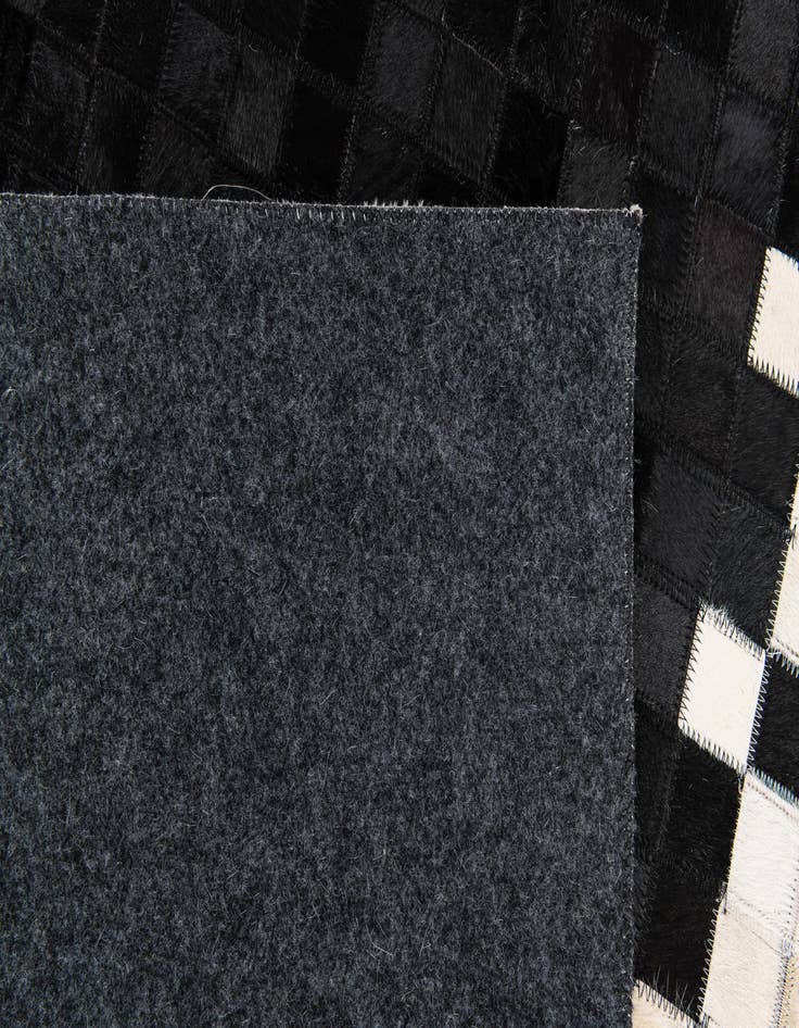 Detail image of  4' 10 x 7' 9 Cowhide Stocks Rug