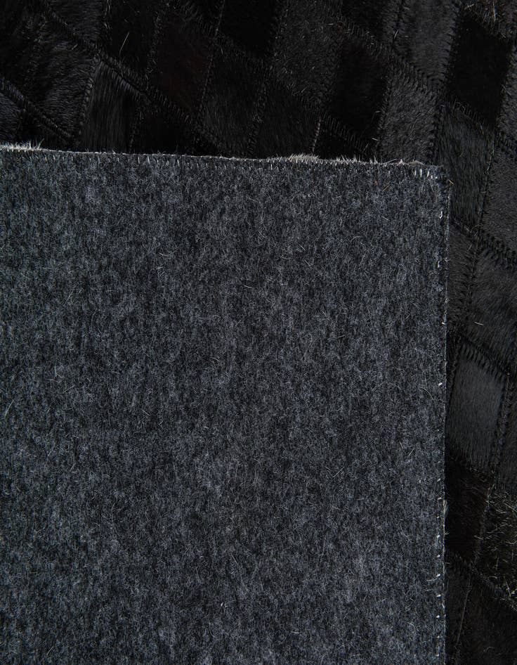 Detail image of  4' 11 x 7' 10 Cowhide Stocks Rug