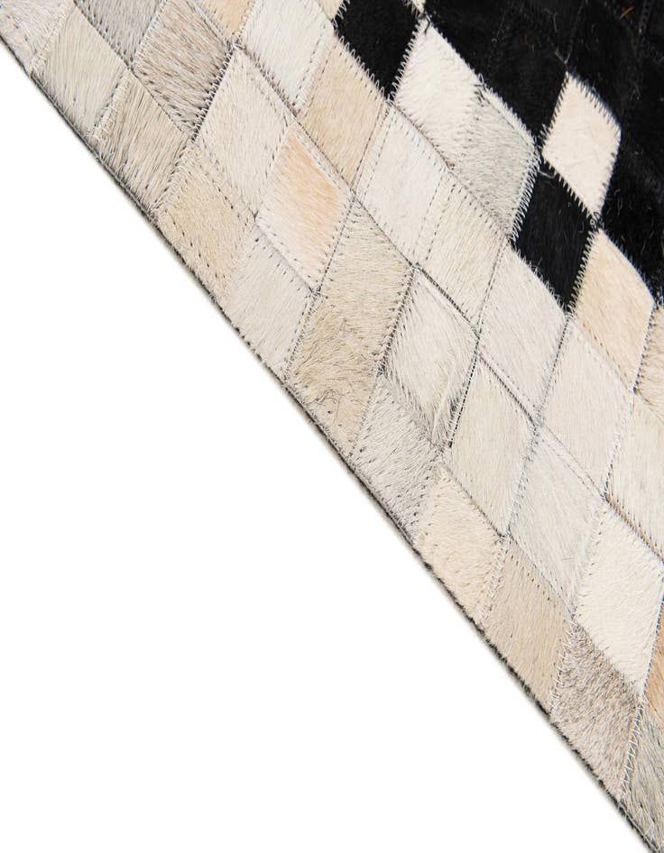 Detail image of  4' 11 x 7' 10 Cowhide Stocks Rug