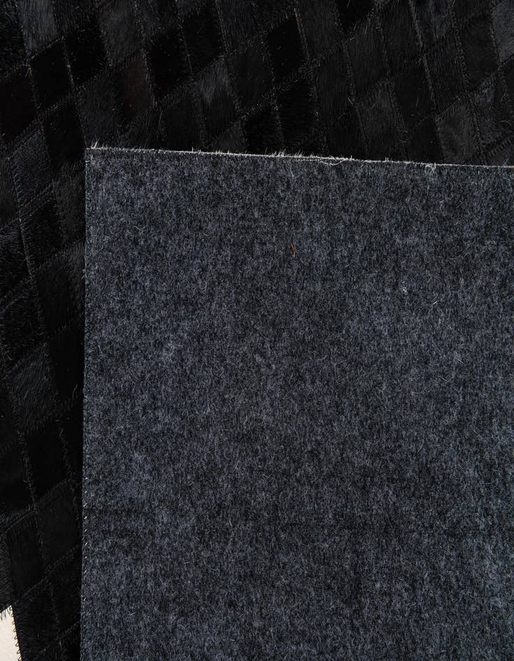 Detail image of  4' 11 x 7' 10 Cowhide Stocks Rug