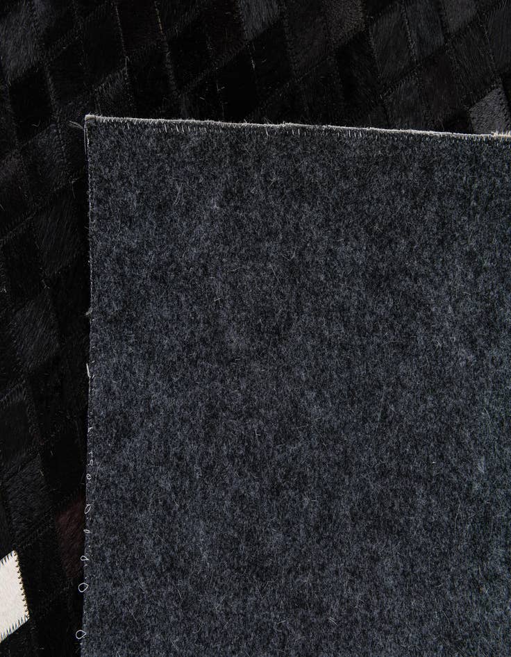 Detail image of  5' 1 x 7' 10 Cowhide Stocks Rug