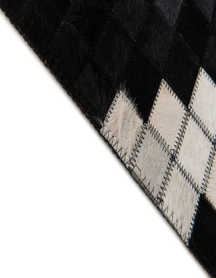 Detail image of  5' 2 x 8' Cowhide Stocks Rug