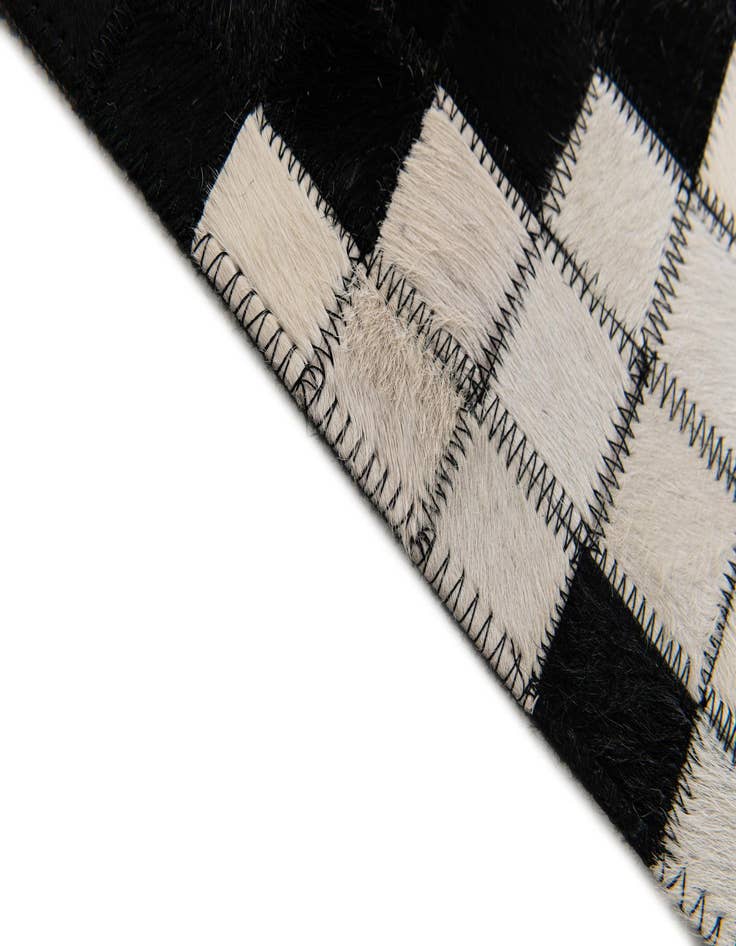 Detail image of  5' 2 x 8' Cowhide Stocks Rug