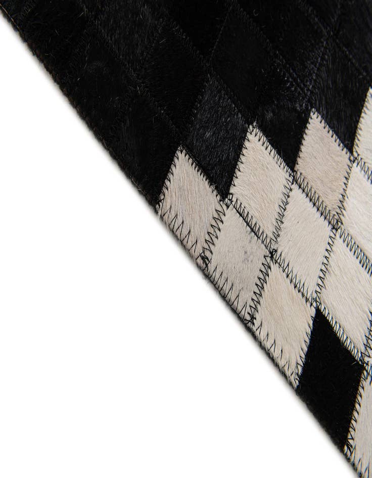 Detail image of  5' 2 x 8' Cowhide Stocks Rug