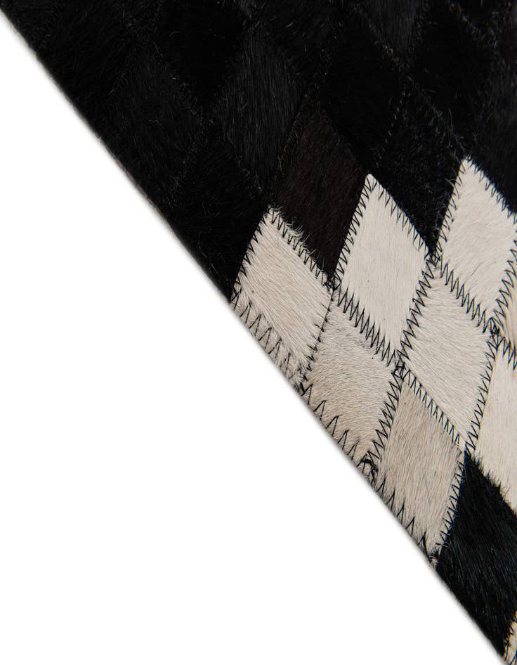 Detail image of  5' 1 x 7' 11 Cowhide Stocks Rug