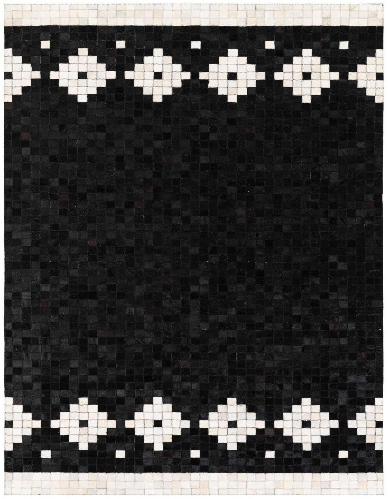 A 5x8 rectangular black cowhide rug with a modern geometric pattern of white diamonds and squares at the top and bottom borders.